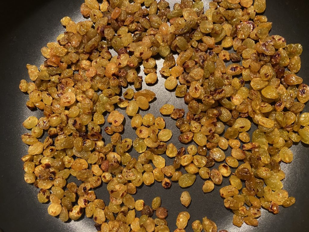 image of toasted golden raisins, caption: *this is more than a cup of raisins and in a much larger pan. I just wanted to show you the brown toasty spots on the raisins